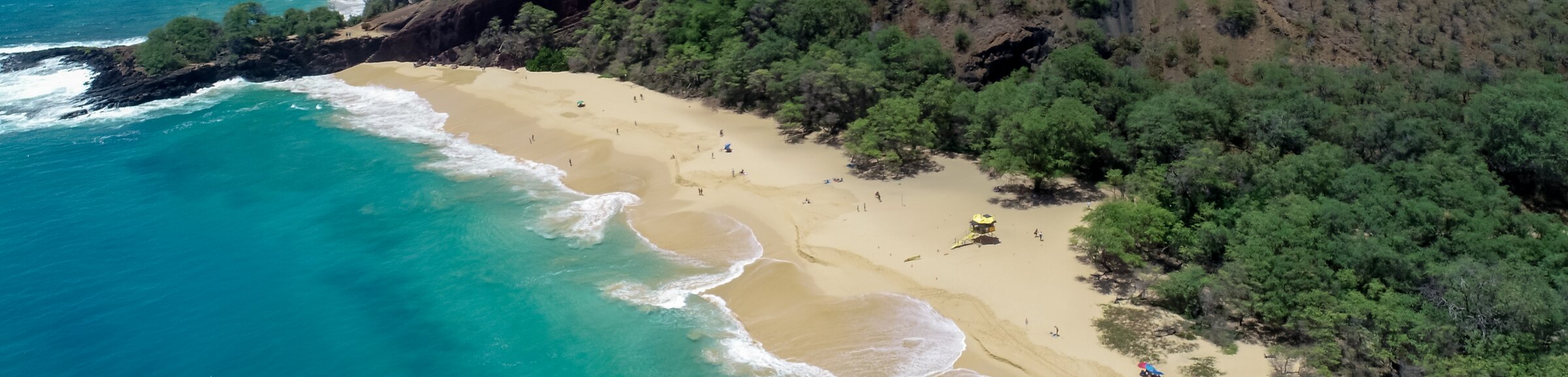 Aerial view of turquoise water and sandy Mākena Big Beach on Maui
